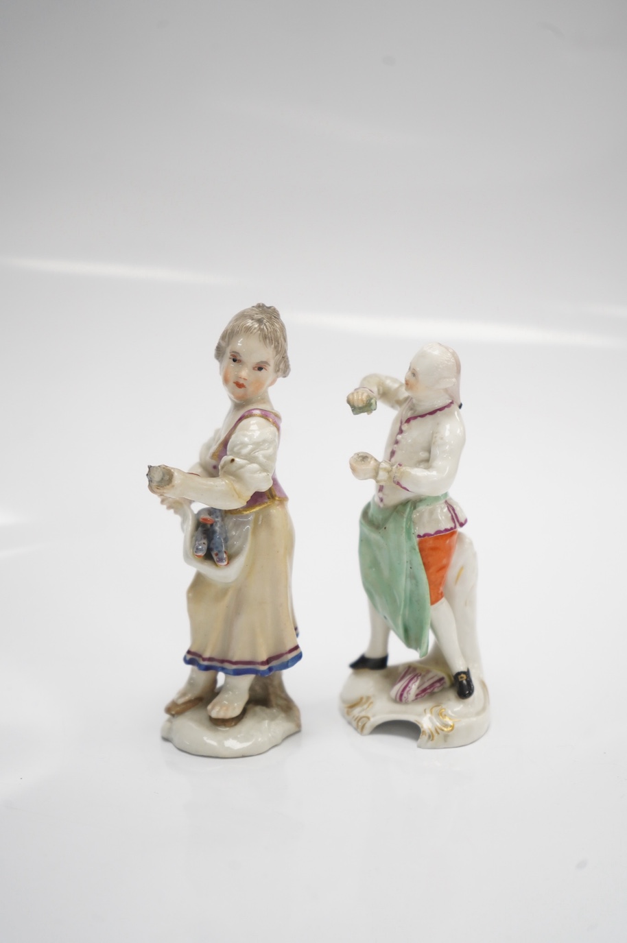 Two 19th century German porcelain figures, Hochst and Buen Retiro style marks, 9.5cm. Condition - fair